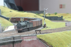 Ex LNWR G2 No 49394 drifts over the junction at Slattocks with a fitted freight bound for Moston