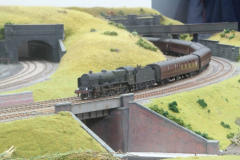 A Manchester express rounds the corner under the River Roch aqueduct